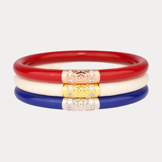 America Three Kings AWB® Stack: three smooth bangles in red, white, and blue with floral clasps; sizes S, M, L available.