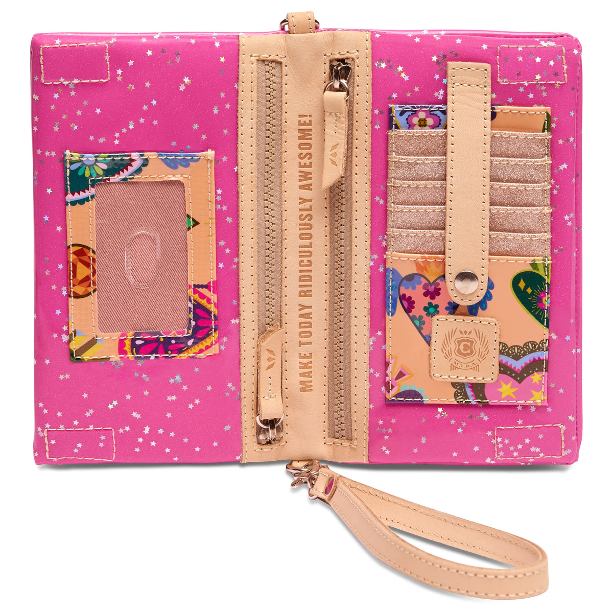 Uptown Crossbody in Berry features a star and colorful heart pattern, tan zipper, wristlet strap, card slots, ID window, and multiple zipper compartments. Interior includes “MAKE TODAY RIDICULOUSLY AWESOME.” Available in various sizes.
