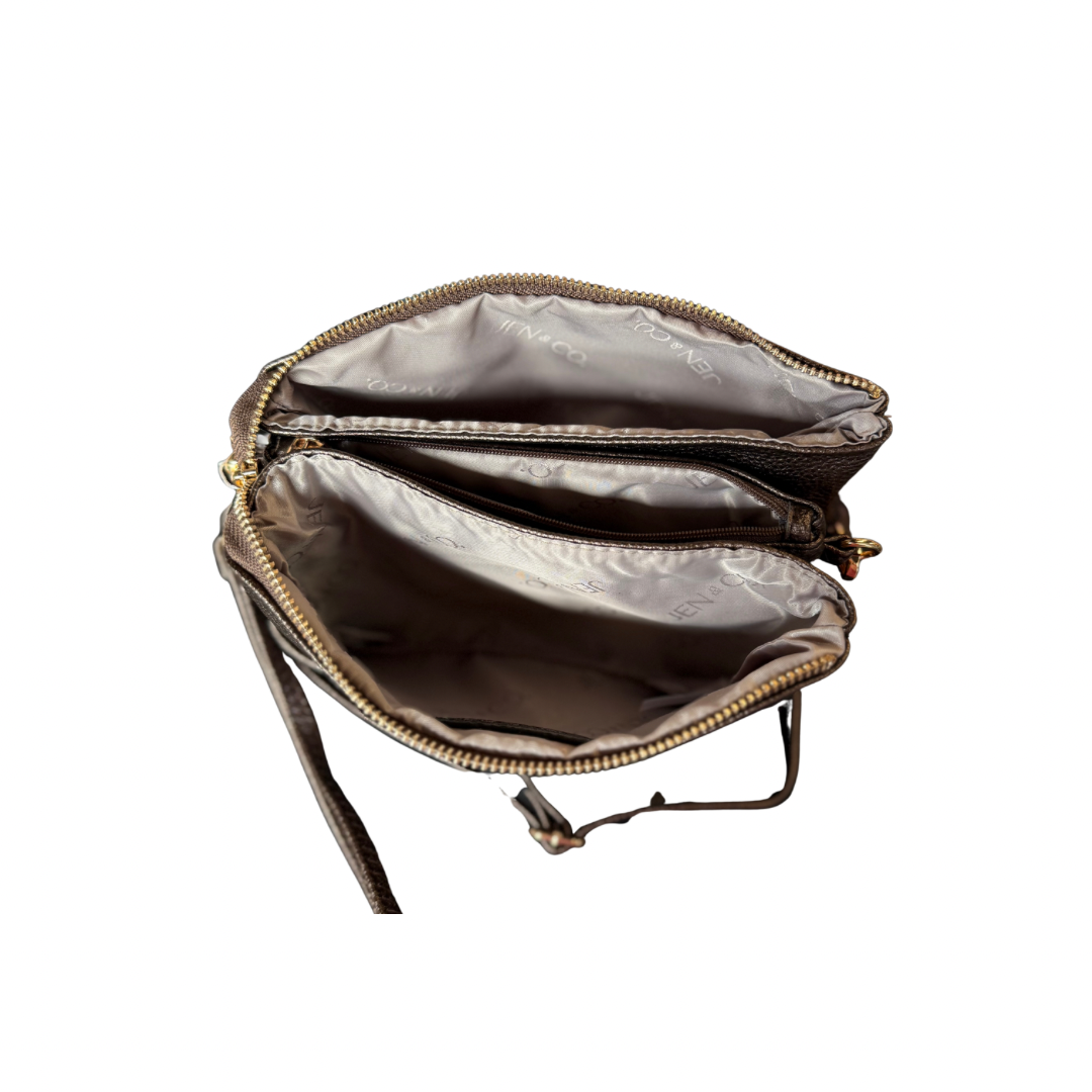 Brown vegan leather Riley Crossbody Bag, two zippered compartments, side strap, compact design. Sizes: Small, Medium.