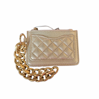 The Rhodes Vegan Quilted Bangle Wallet is a small gold wallet with a zipper closure and chunky gold chain. Available in small size.