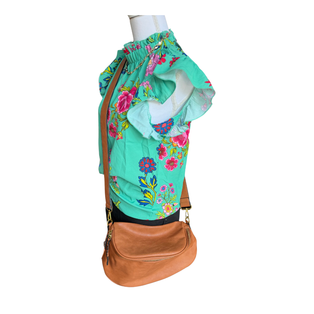 Tan Megan Sling Bag in vegan leather with adjustable strap. Available in S, M, and L.