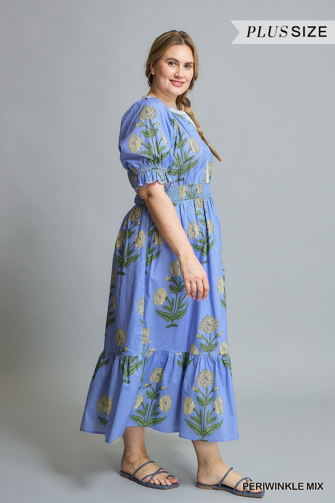Avery Floral Smocked Midi Dress in Periwinkle Mix. Blue floral-print, short sleeves, ruffle details, smocked bodice. Available in Plus Sizes 1X-4X.