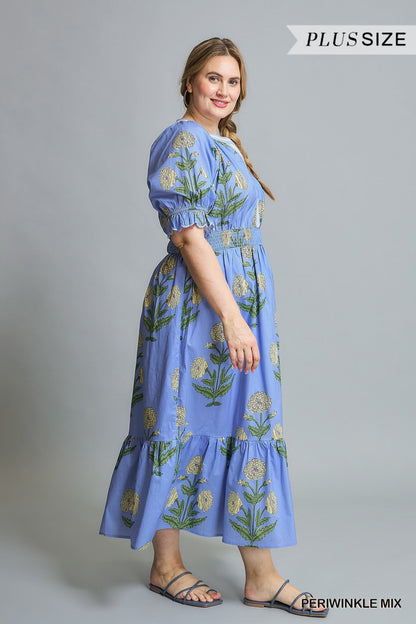Avery Floral Smocked Midi Dress in Periwinkle Mix. Blue floral-print, short sleeves, ruffle details, smocked bodice. Available in Plus Sizes 1X-4X.