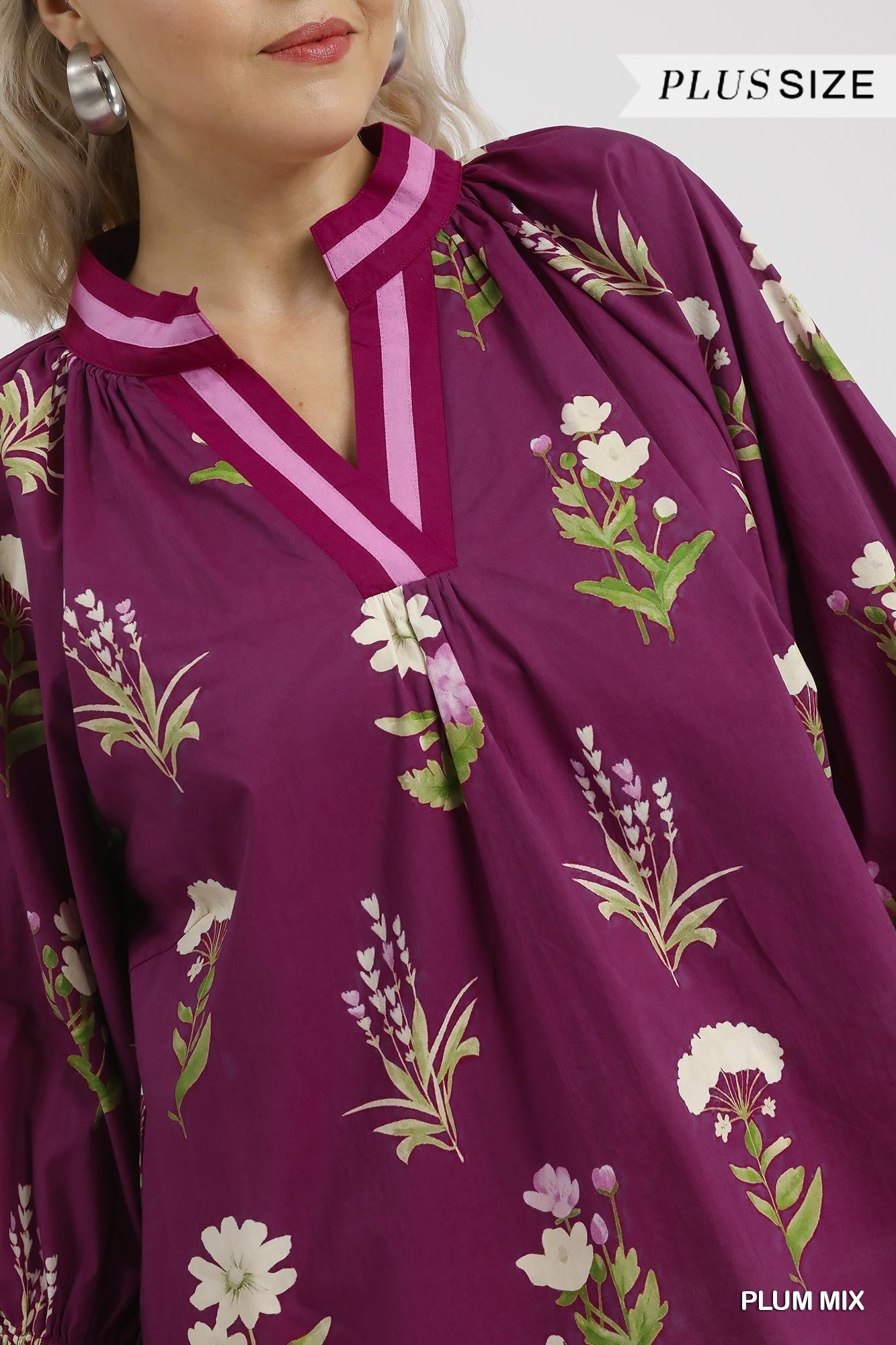 Floral Contrast Trim Blouse in plus-size, plum mix with white/green floral print, notched neckline, gathered sleeves. Sizes: 1X–4X.