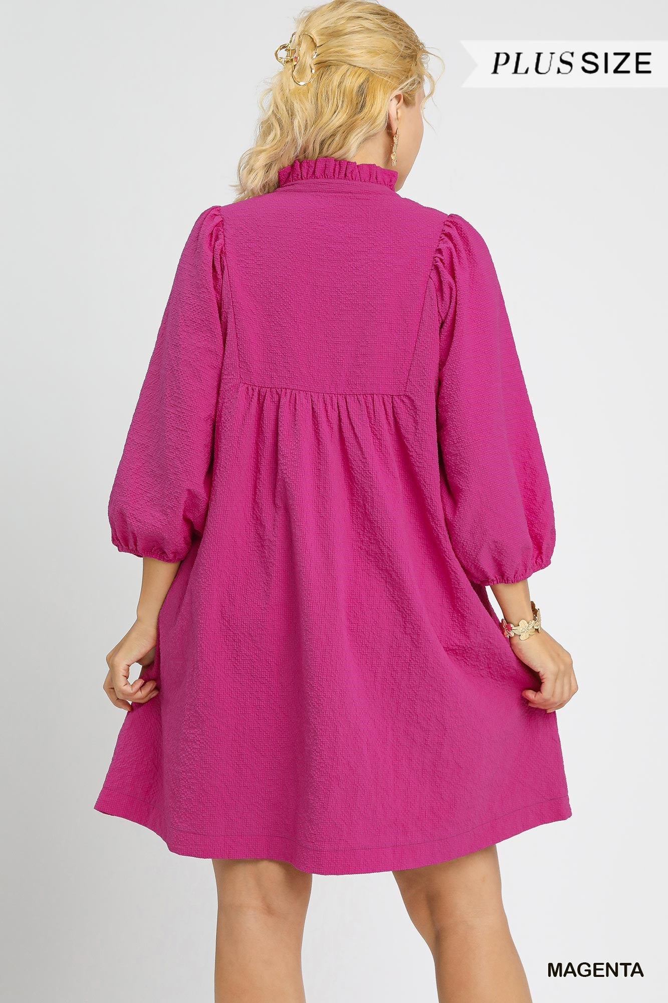 Magenta plus-size knee-length dress with 3/4 puff sleeves, ruffled collar. Available in sizes 1X-4X.