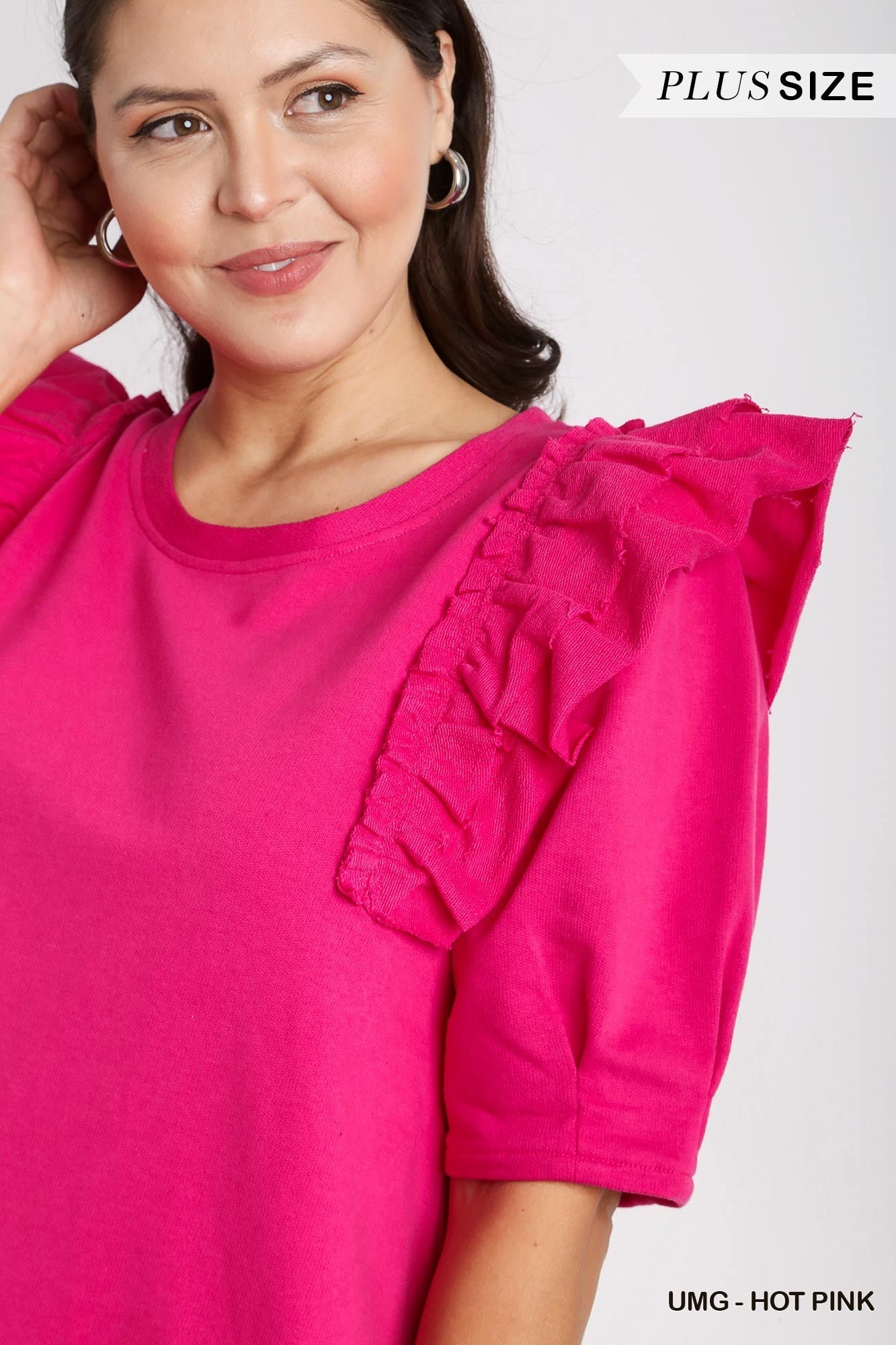 This is a vibrant hot pink, plus-size Round Neck French Terry Dress with 3/4 Ruffle Sleeves. Available in various plus sizes.