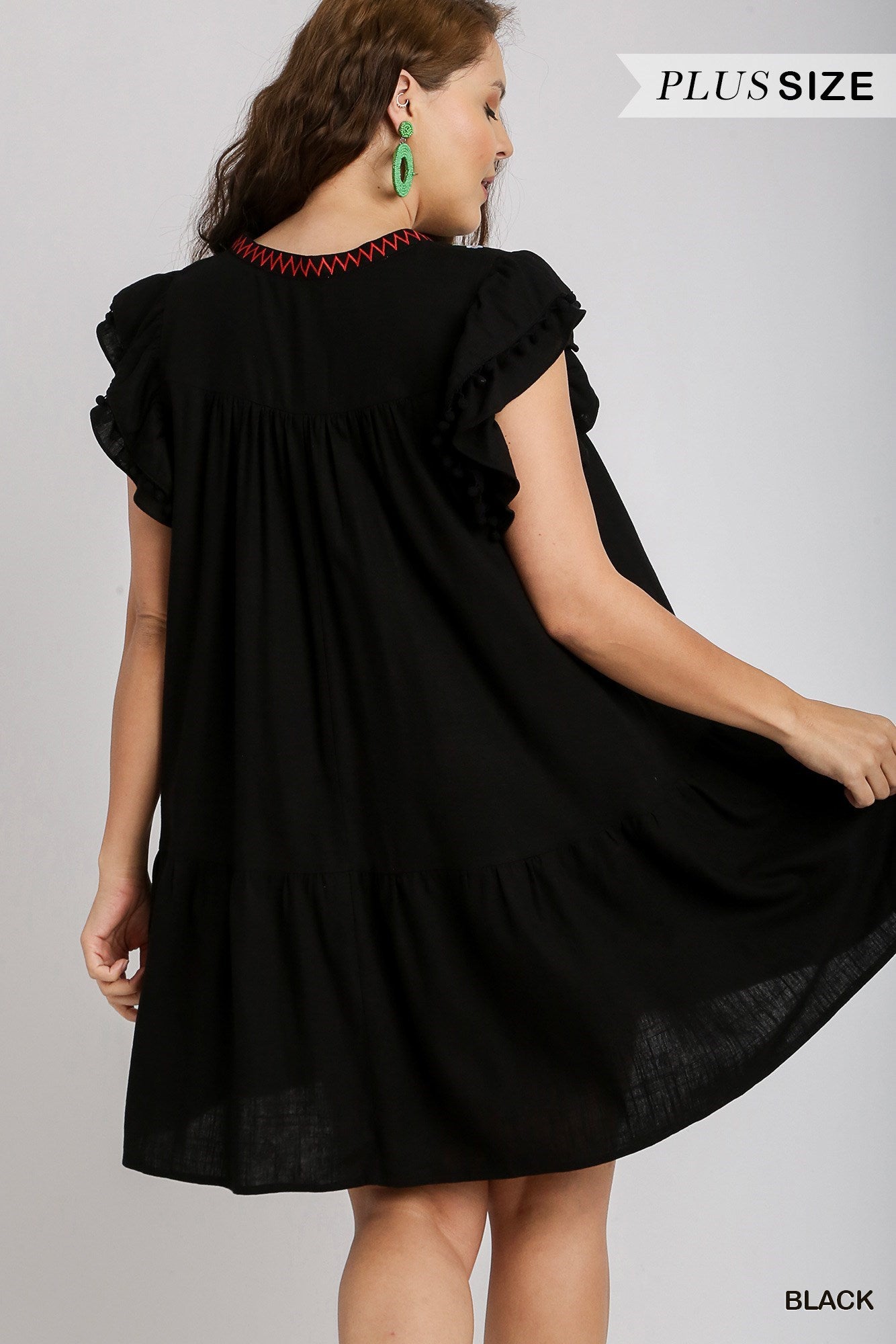 Black Linen Embroidered Short Dress with Ruffle Sleeves & Pom Poms. Features a back view design.