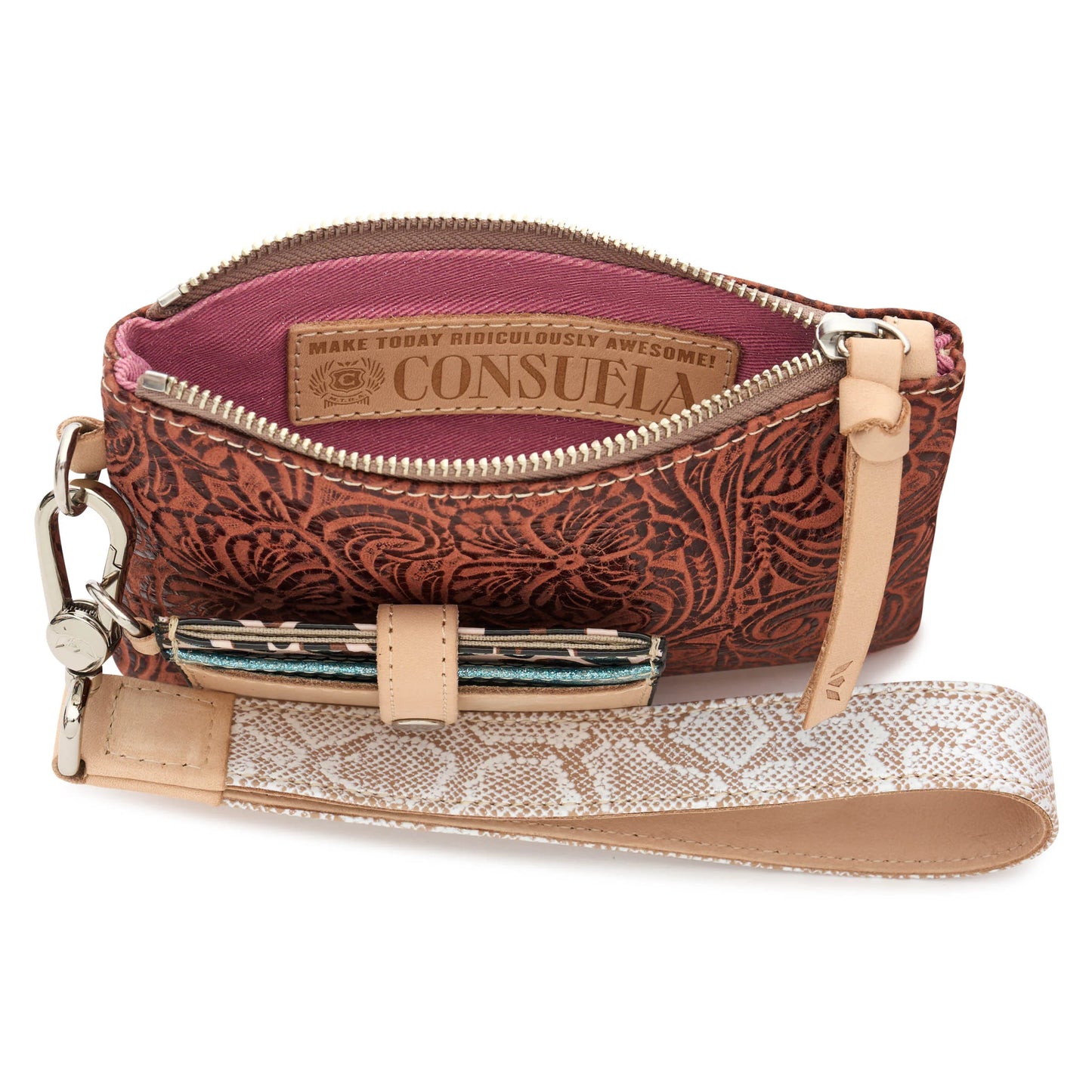 Brown floral zippered wristlet wallet with tan leather strap, pink interior with motivational label, and small loop for a patterned pen. Sizes available: not specified.
