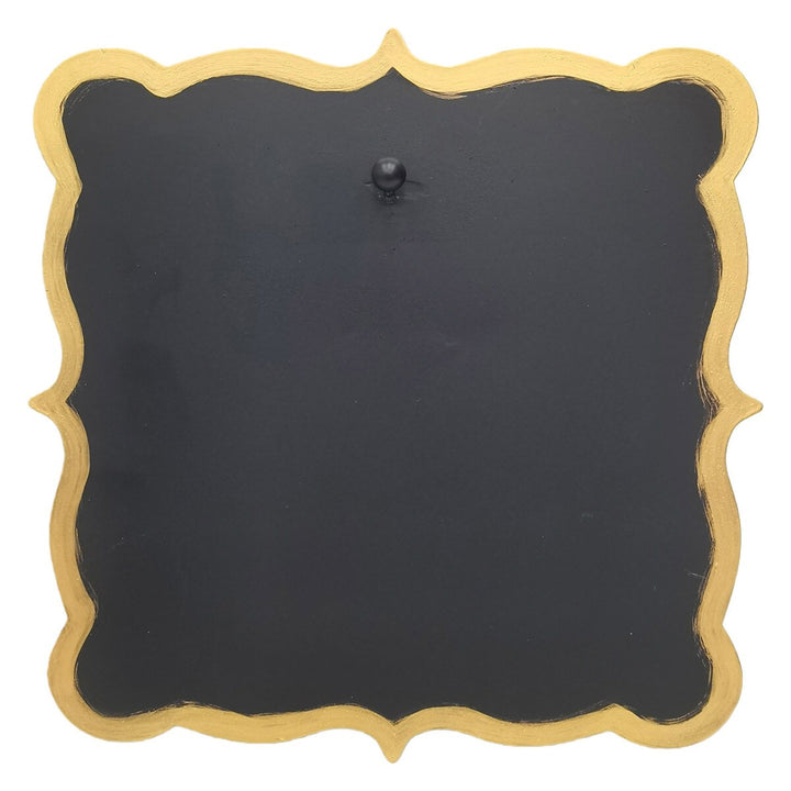 Black and gold square scalloped display board with a central black knob.