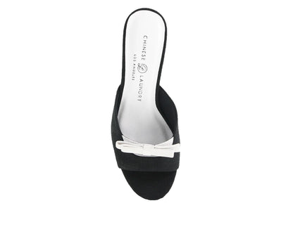 The Yolana Heel - Black/White: Stylish black slip-on with a white bow accent, thin sole. Sizes available: 6-10.
