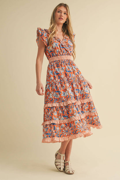 Mixed Floral Print Ruffle Trim Midi Dress with flutter sleeves, smocked waistband. Available in sizes XS-XL.