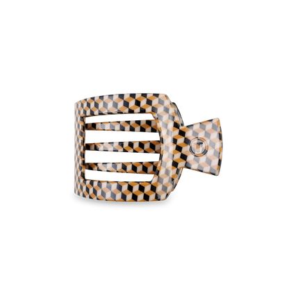 The TELETIES Square Flat Hair Clip has a geometric pattern with interlocking black, white, and brown shapes. It features a strong-grip, wide rectangular design with a glossy finish. Available in one size.