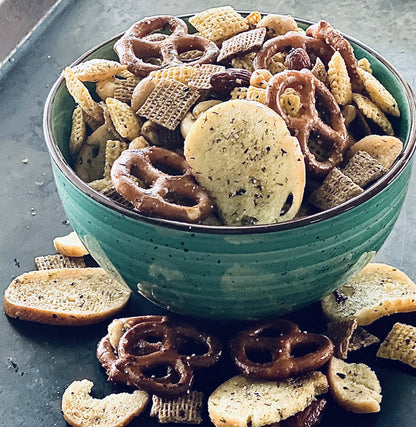 Snack mix of pretzels, cereal squares, bagel chips, and nuts for Buttermilk Ranch Seasoning. Available in small and large sizes.