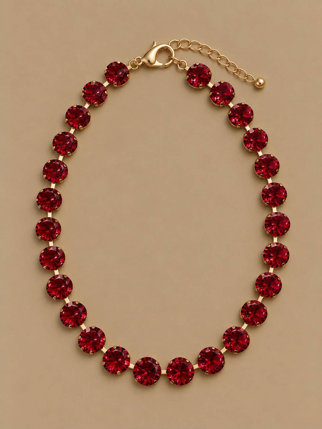 Gold-tone Gemmies round stone necklace, red, circular strand of stones.