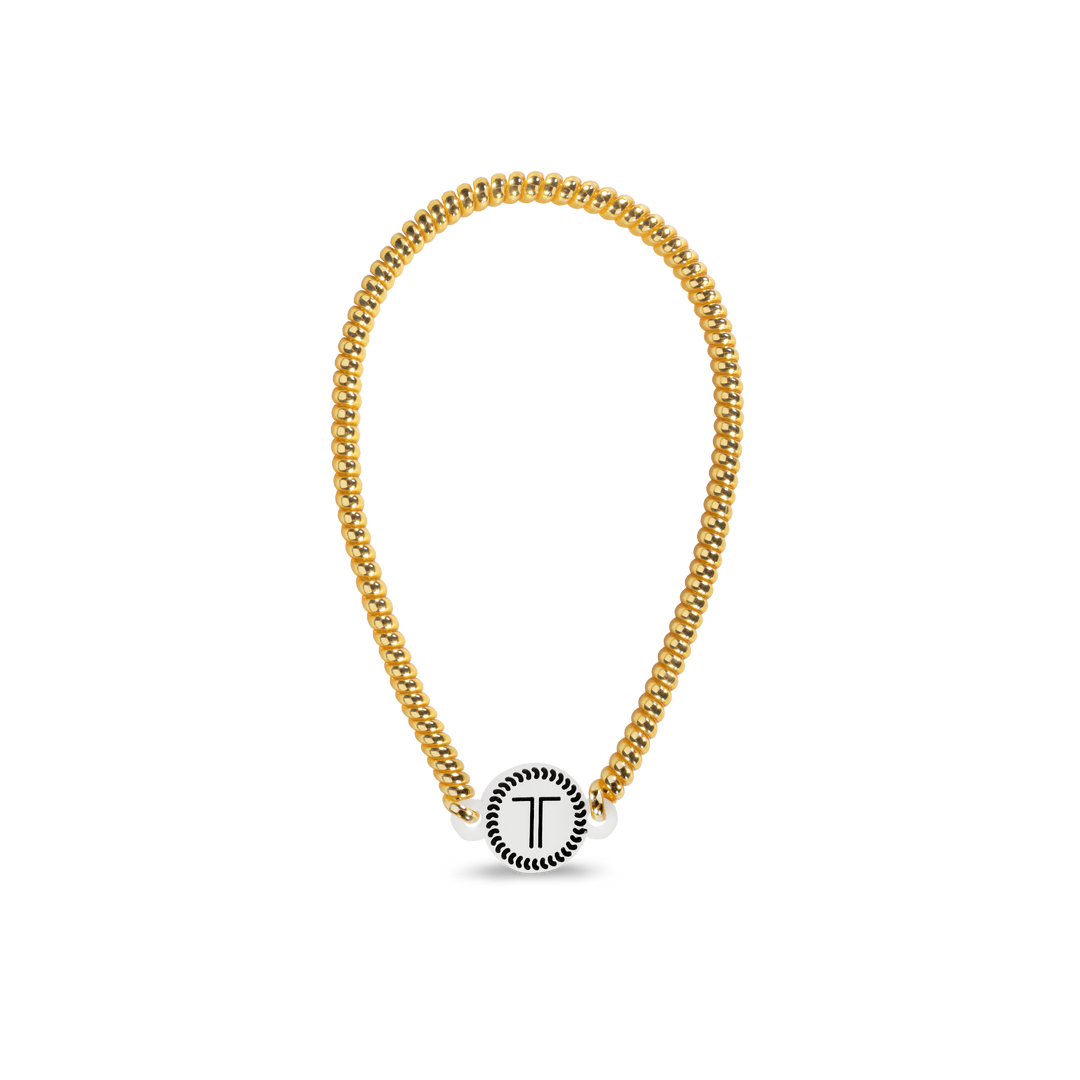 Gold chain bracelet with round white clasp, black "T" design. Available in small, medium, and large sizes.