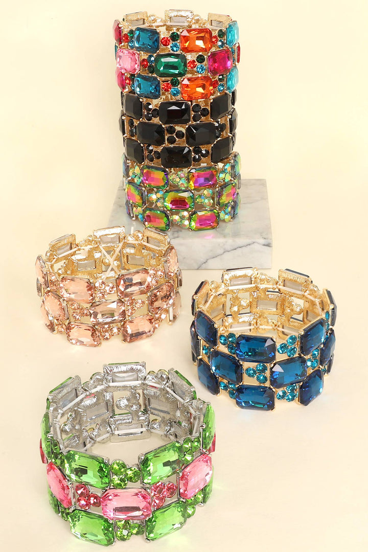 Five 3-row rectangle cut crystal gem cluster bracelets in black, pink, blue, green, and multicolor. Sizes available: S, M, L.