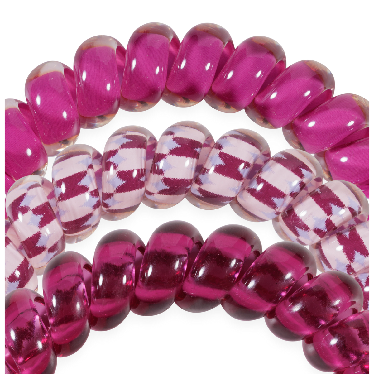 Three Merlot after Midnight Large Hair Ties: two shiny magenta, one clear with magenta zigzag. Available in large size for secure, crease-free hold.
