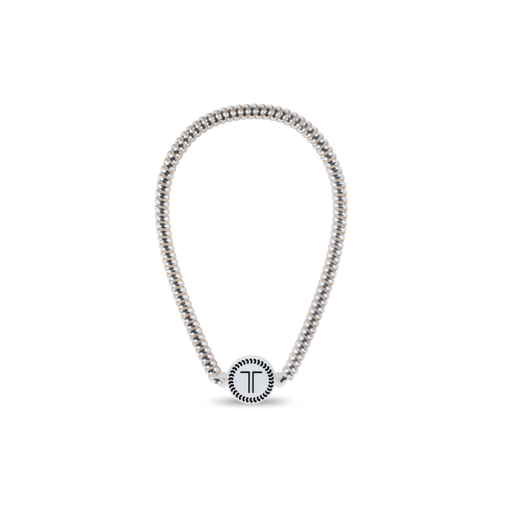Silver beaded necklace with round “T” pendant and decorative border. Available in 16", 18", and 20" sizes.