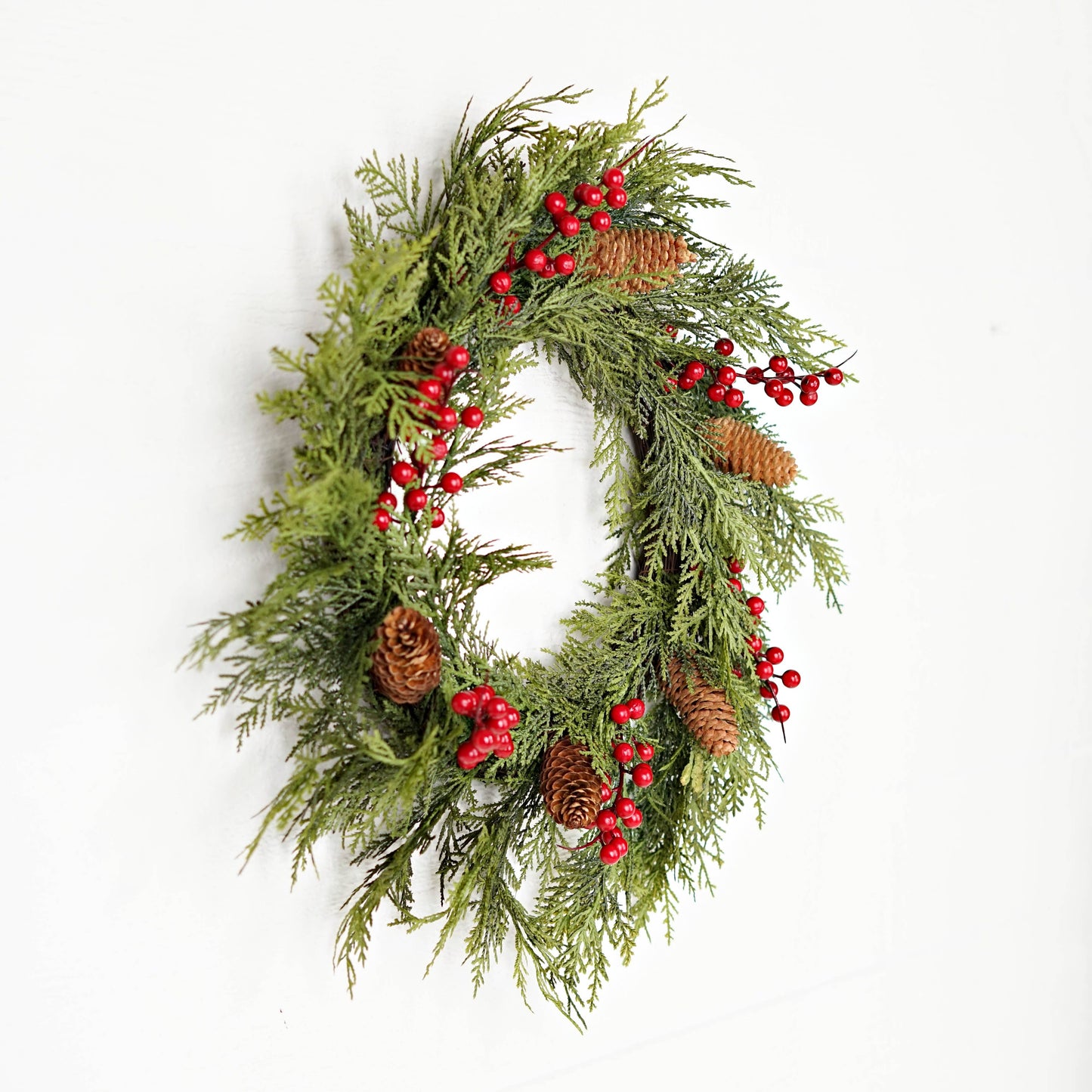 22-inch 510050-Superior Real Touch Mix Cedar twig wreath with pinecones and red berries.