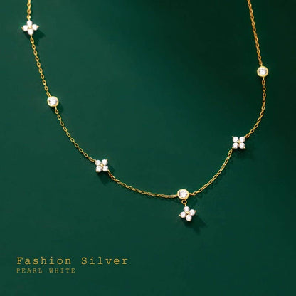Four Petal Flower Friendship Necklace in 925 sterling silver with white pearls, cubic zirconia charms. Sizes: S, M, L.