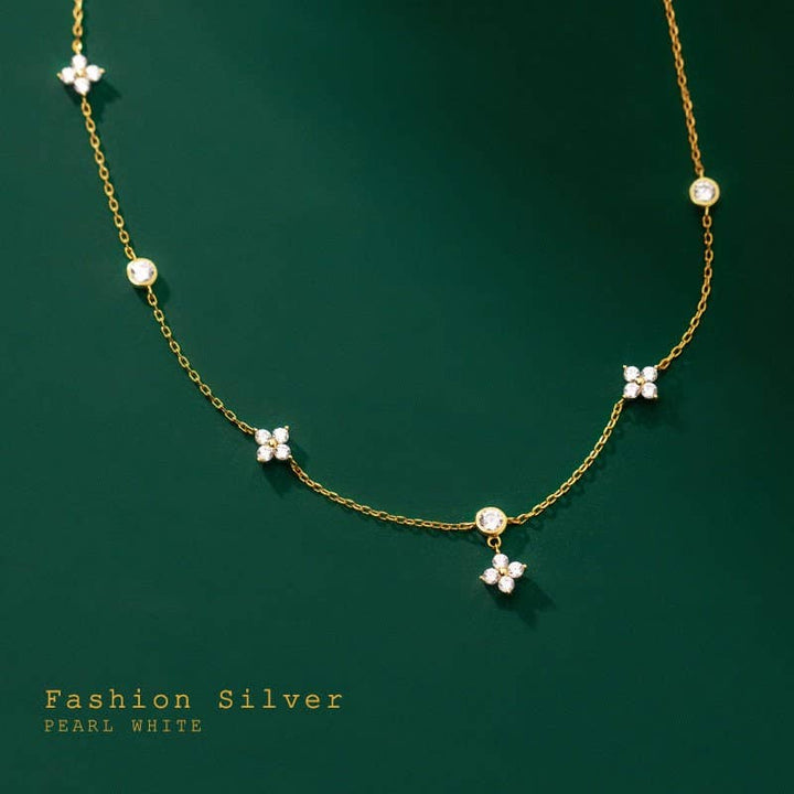 Four Petal Flower Friendship Necklace in 925 sterling silver with white pearls, cubic zirconia charms. Sizes: S, M, L.