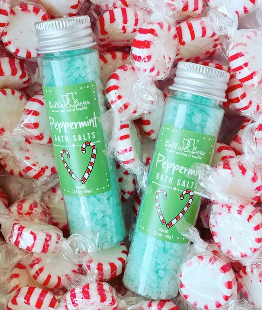Candy Land Christmas Bath Salts Gift Set of two clear plastic bottles of turquoise bath salts with silver lids and candy cane labels.