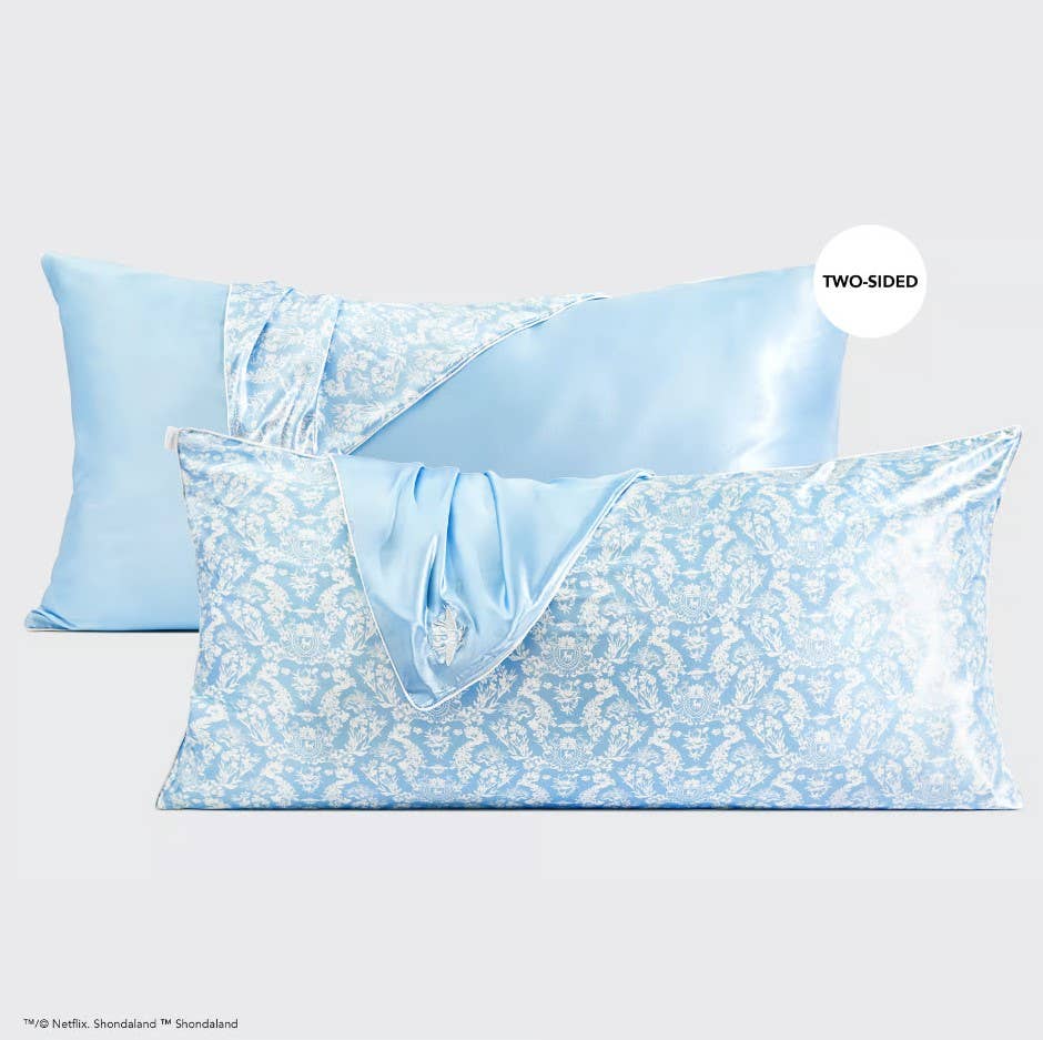 Two Kitsch x Bridgerton King Satin Pillowcases in Toile De Blue, reversible with solid blue and blue floral print; King size.