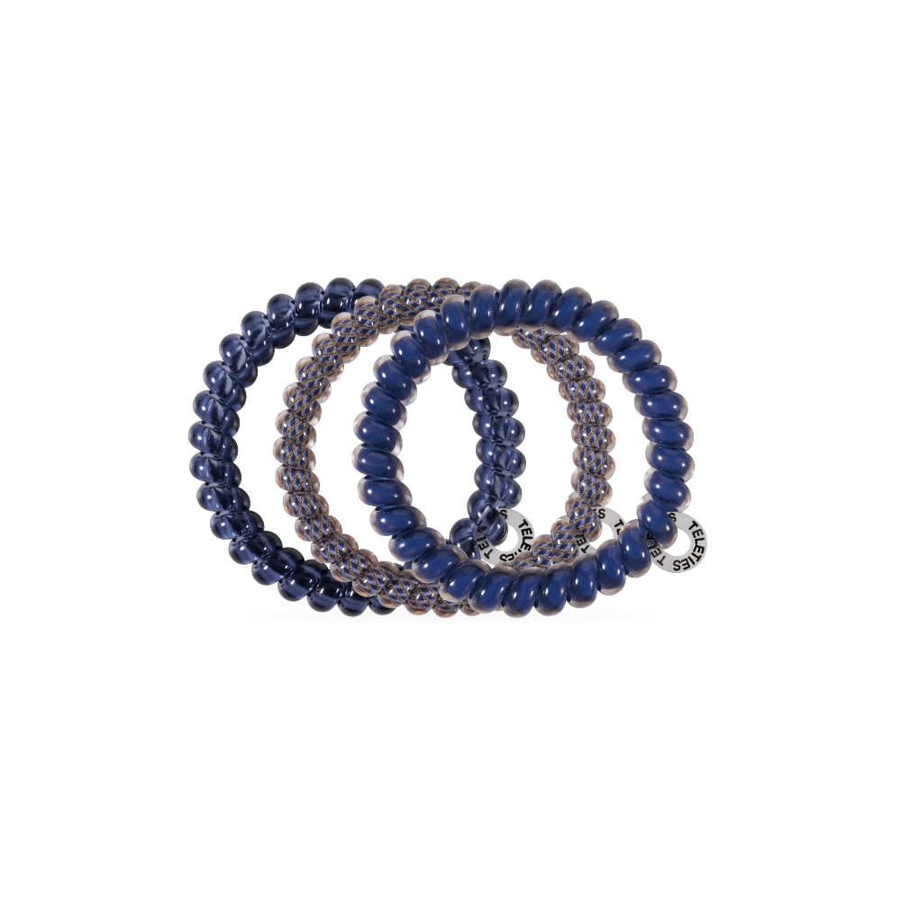 Three Twilight Tones Small Hair Ties in navy blue and clear, each with a round metallic charm. No-crease design. Available in small size.