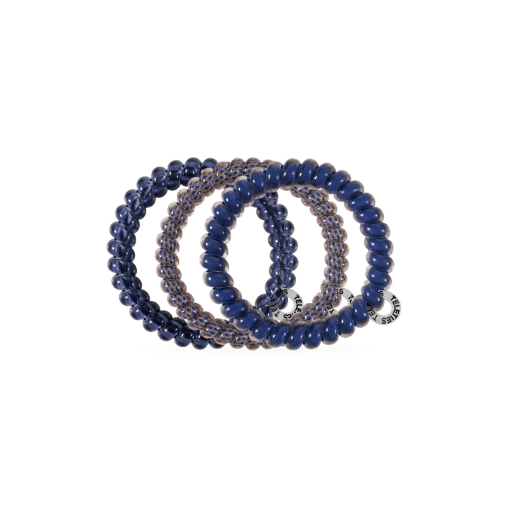 Three Twilight Tones Small Hair Ties in navy blue and clear, each with a round metallic charm. No-crease design. Available in small size.