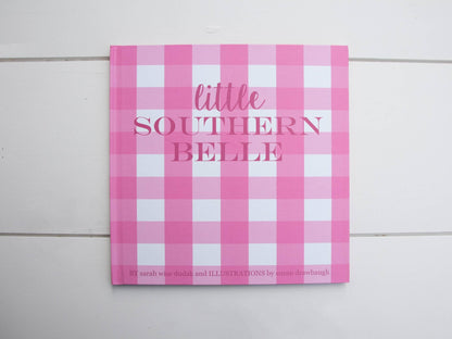 Little Southern Belle" children's book, pink and white checkered cover. Available in hardcover and paperback sizes.