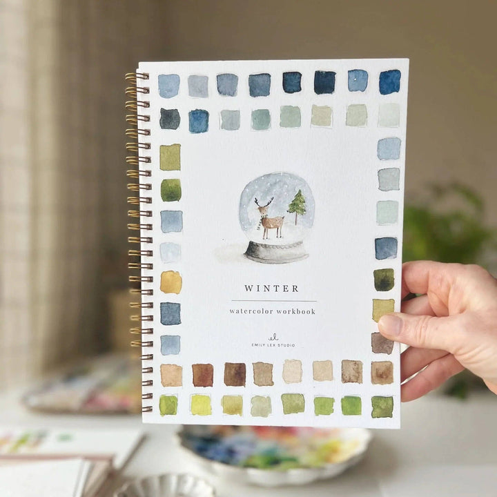 Spiral-bound Winter watercolor workbook with step-by-step instructions.