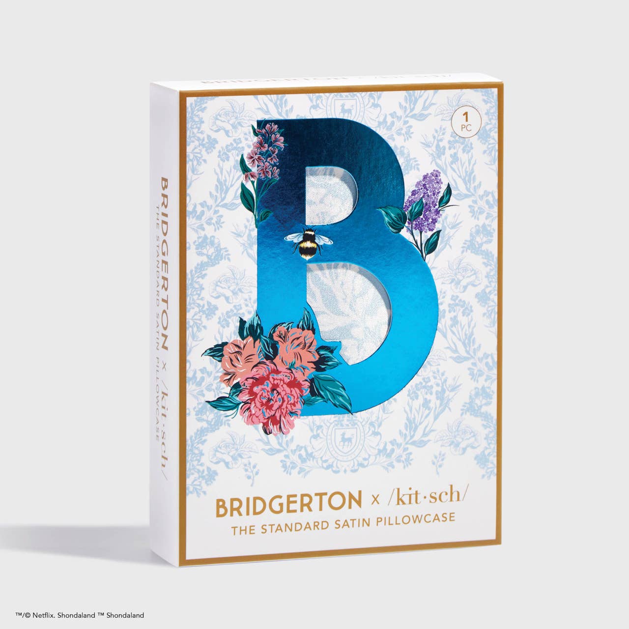 Satin pillowcase with large blue "B," colorful flowers, gold trim, ornate blue pattern. Available in standard and king sizes.