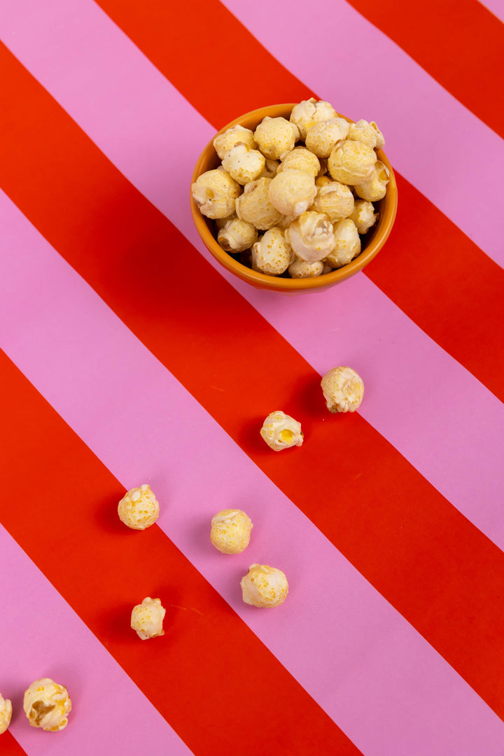 Funnel Cake Popcorn in a bowl. Available in small, medium, and large sizes.