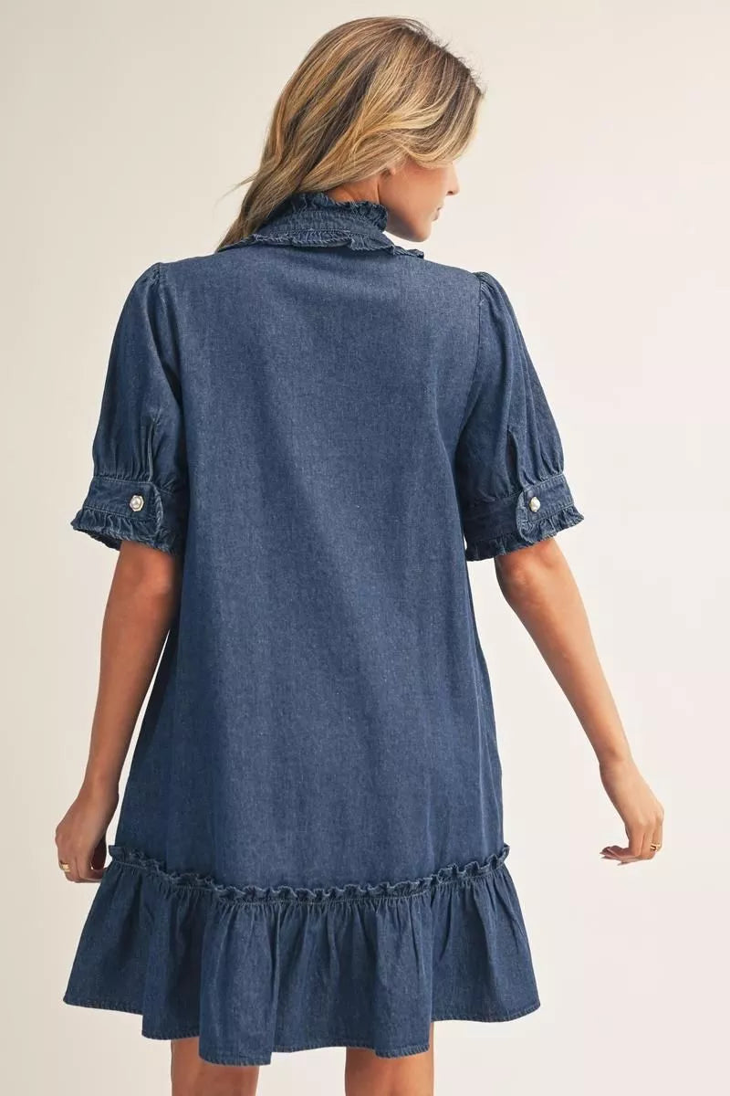 Darcy Ruffle Denim Dress: short-sleeved denim dress with a ruffled collar, buttoned cuffs, and a ruffled hem. Available in sizes.