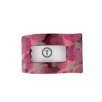 Medium flat rectangular hair clip with wavy design, pink and purple floral pattern, and a central clear window showing the black TELETIES logo. Available in medium size.
