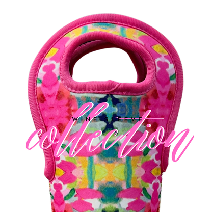 Colorful floral neoprene wine sleeve with pink trim, “Collection” in pink and "WINE SLEEVE" in black. Available in one size.