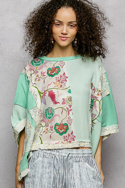 Pastel green Round Neck Double Gauze Floral Woven Top with lace details. Available in sizes XS-XL.