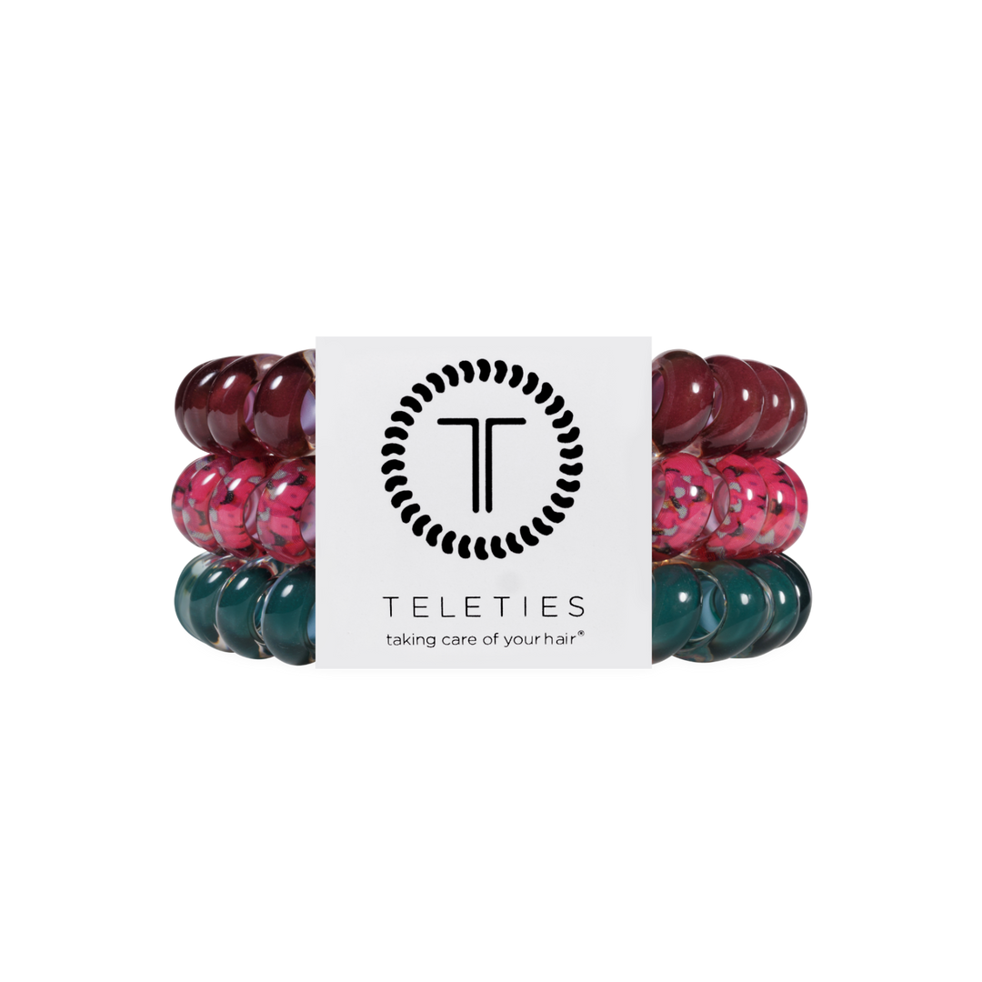 Three Harvest Hues Large Hair Ties from TELETIES in burgundy, floral pink, and teal spiral coils, secured with a branded card. Available in large size. No-crease hair ties for gentle, stylish hold.