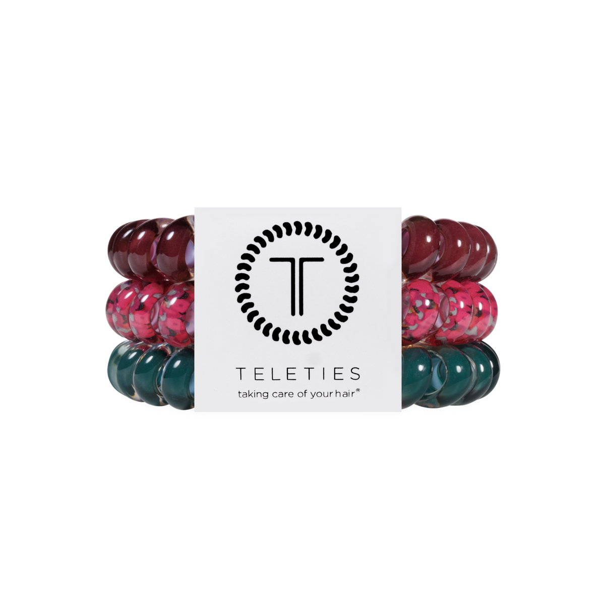 Three Harvest Hues Large Hair Ties from TELETIES in burgundy, floral pink, and teal spiral coils, secured with a branded card. Available in large size. No-crease hair ties for gentle, stylish hold.