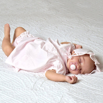 Dress with pintucks and featherstitching, includes matching bonnet. Available in sizes NB, 3M, 6M, and 12M.