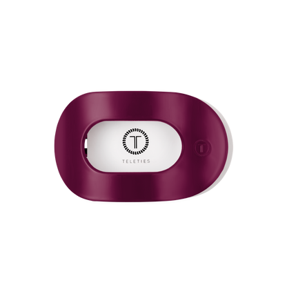 Maroon oval Teleties hair tie holder with logo and text in the center; available in multiple sizes.