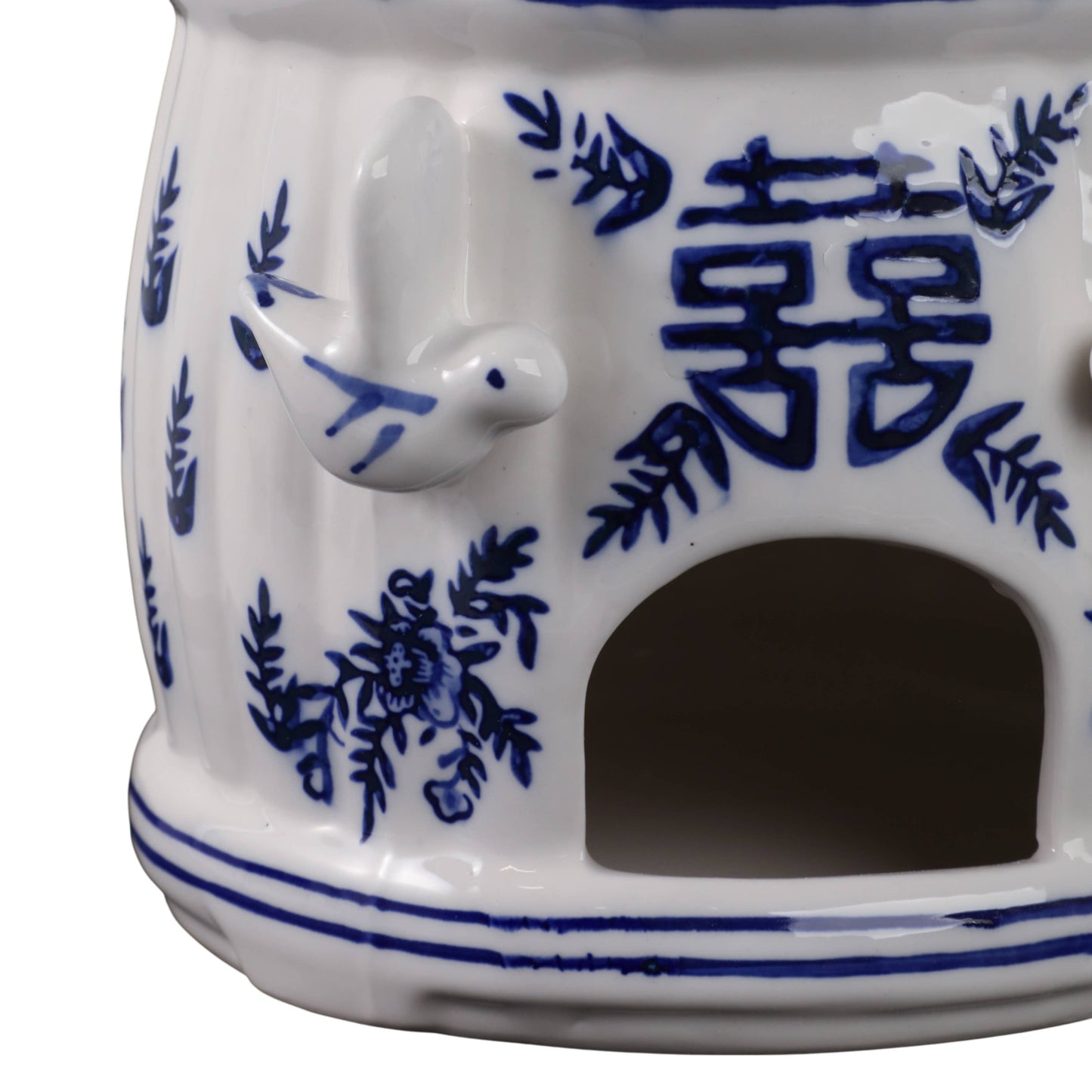 White/blue Chinoiserie pagoda birdhouse, 8 in., with blue floral patterns, bird figurine, and Chinese character.