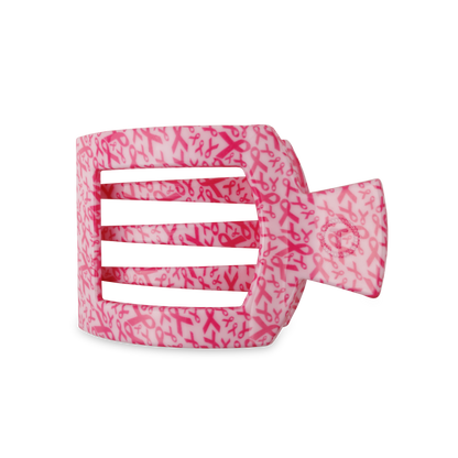 The TELETIES Square Flat Hair Clip is a pink claw clip with small pink ribbons on a light pink background, designed for breast cancer awareness. It features a strong grip and rectangular cutouts for secure hair hold. Available sizes: small, large.