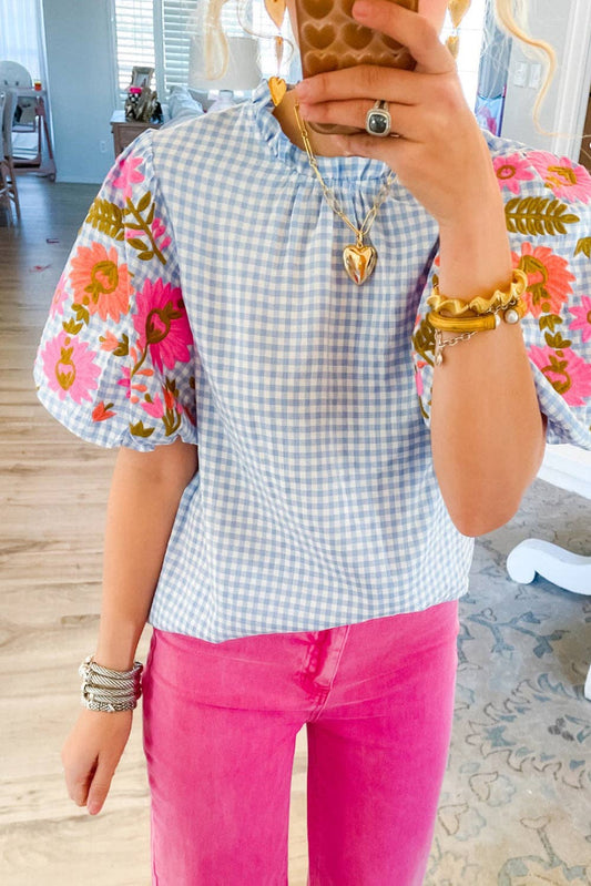 Light Blue Gingham Floral Embroidered Puff Sleeve Blouse shown; available in sizes XS-XL.