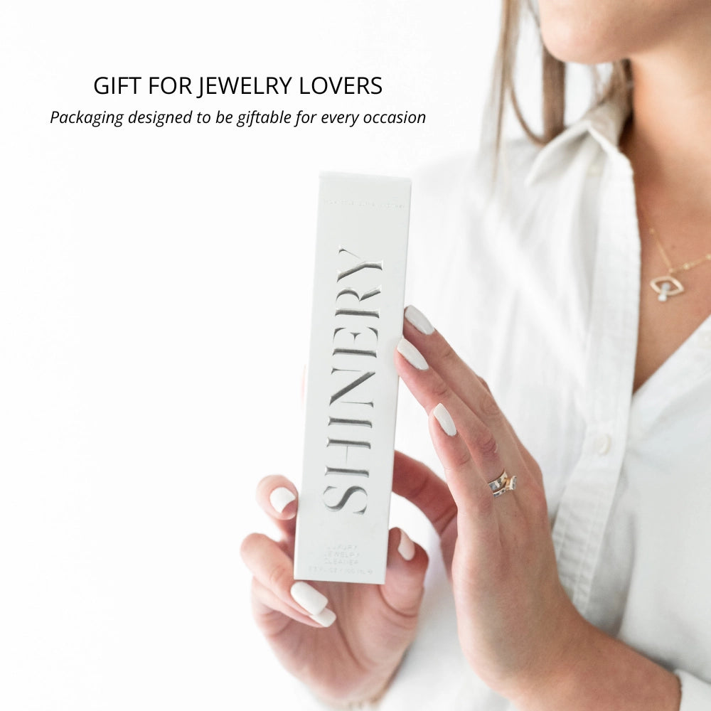 White box labeled "Jewelry Wash® | Shinery," plant-based, non-toxic jewelry cleaner. Available in 30ml and 100ml sizes.