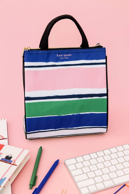 The Lunch Bag, Ocean Stripe has blue, pink, green, and white stripes. Available sizes: small, medium, large.