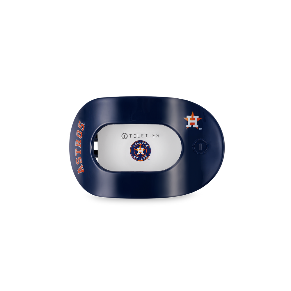 Navy blue oval hair clip with "Astros," TELETIES logo, orange Astros symbol; available in small and large sizes.