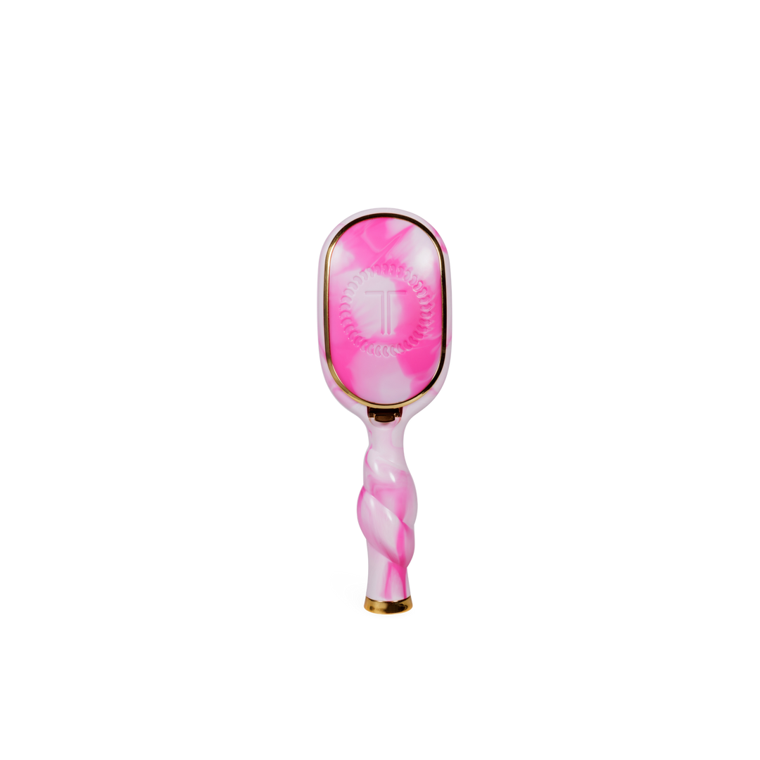 Mini Detangler Brush in “Pinch Me!” style with pink and white colors, shiny marbled handle, and gold accents. Available in mini size.