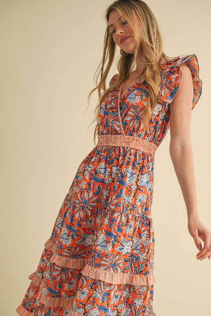 Mixed Floral Print Ruffle Trim Midi Dress with red, blue, and white patterns, smocked waistband. Available in sizes XS-XL.