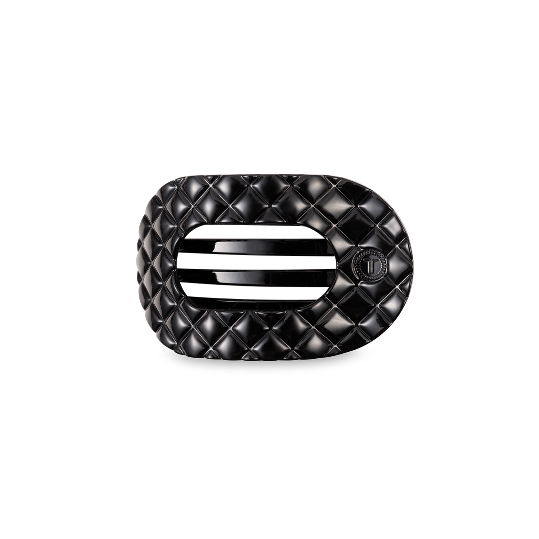 Black quilted rectangular buckle with rounded edges, two slots, small circular emblem; available in small and large sizes.